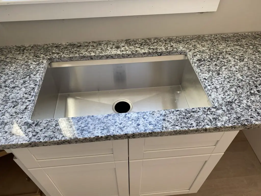 Countertop Installers Install The Sink, How To Cut Granite Countertops Sink Hole